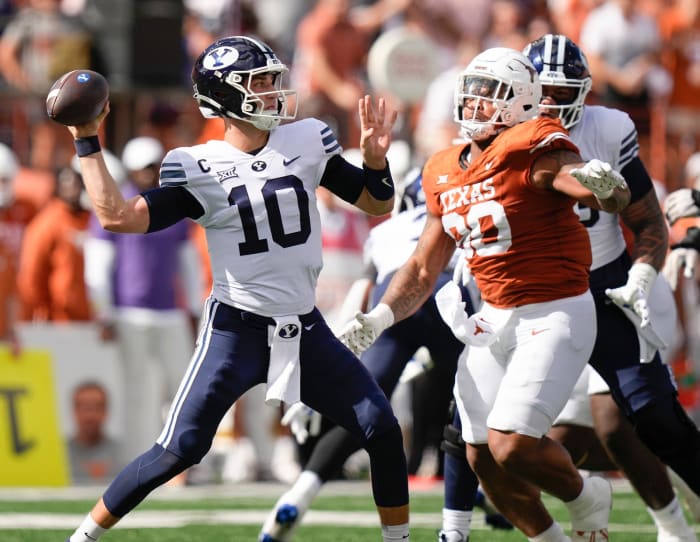 BYU Cougars quarterback Kedon Slovis throws under pressure from Texas Longhorns defensive lineman Byron Murphy II. © Jay Janner/American-Statesman / USA TODAY NETWORK